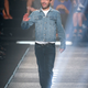 French fashion designer Nicolas Ghesquiere acknowledges applause after the presentation of Louis Vuitton's Spring/Summer 2015 ready-to-wear fashion collection presented in Paris, France, Wednesday, Oct. 1, 2014. (AP Photo/Jacques Brinon)